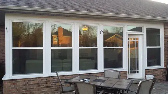 Exterior House wall with windows and table