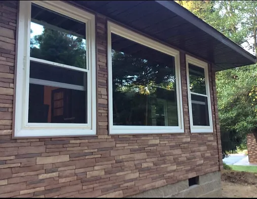 Vinyl Siding with the look of natural stone with Energy Star windows.