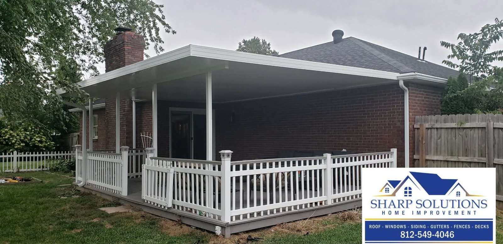 Black Roofing Tile New Roof Gutters on porch Deck overlooking the backyard Window overlooking patio